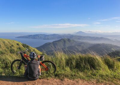 man Sitting Beside Bicycle